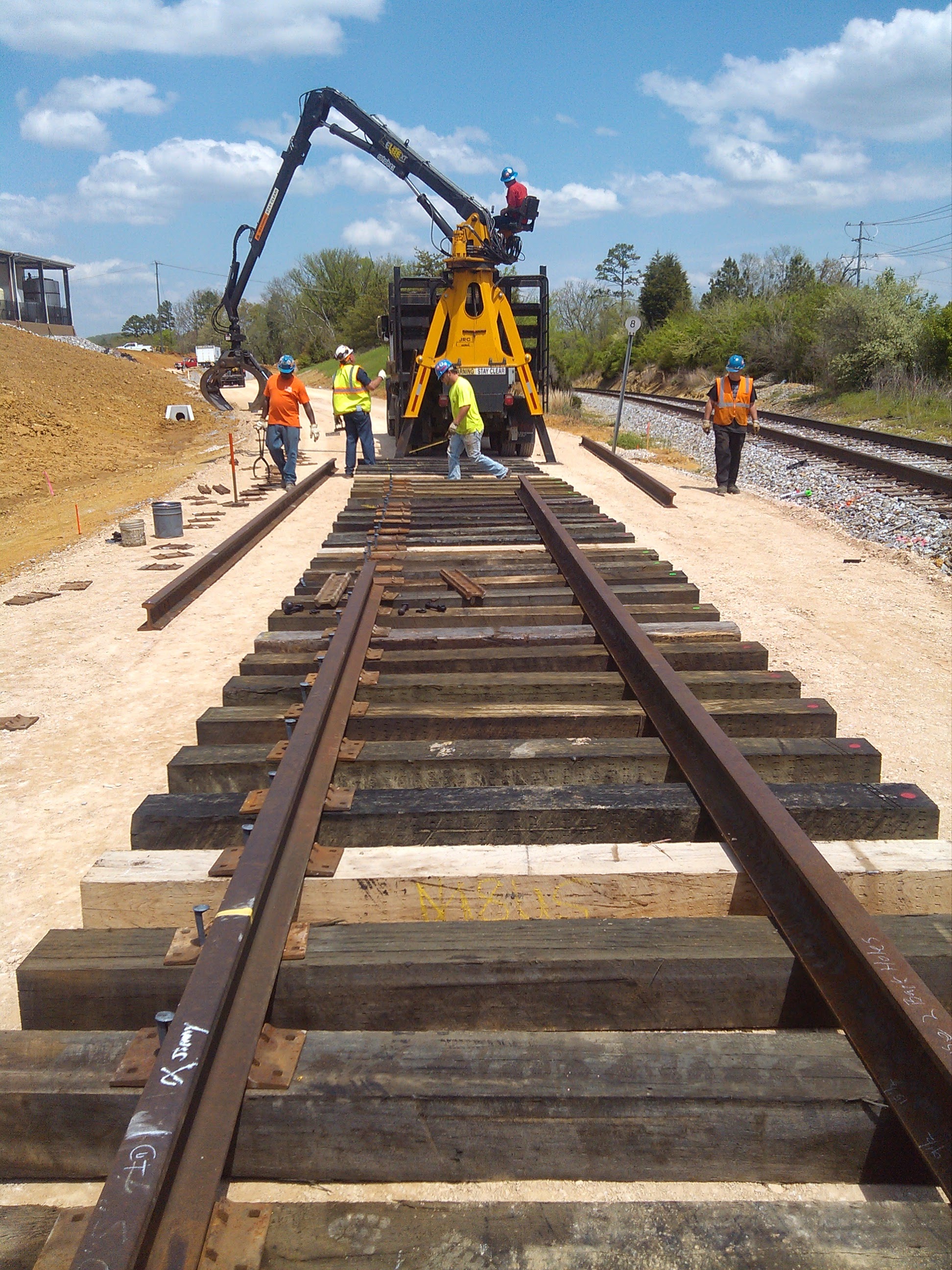 Railroad track construction with heavy machinery